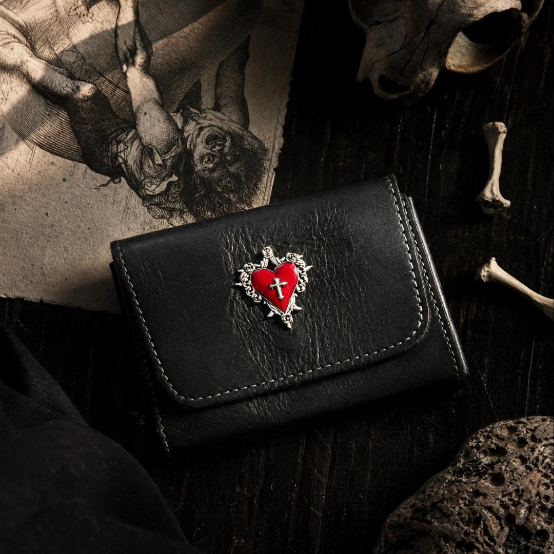 Small gothic wallet combining vintage craftsmanship with practical organization