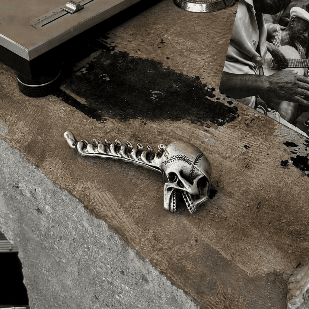 Gothic skull bottle opener used at a dark aesthetic home bar