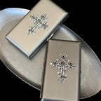 Brushed metal cigarette case with ornate gothic rose cross centerpiece